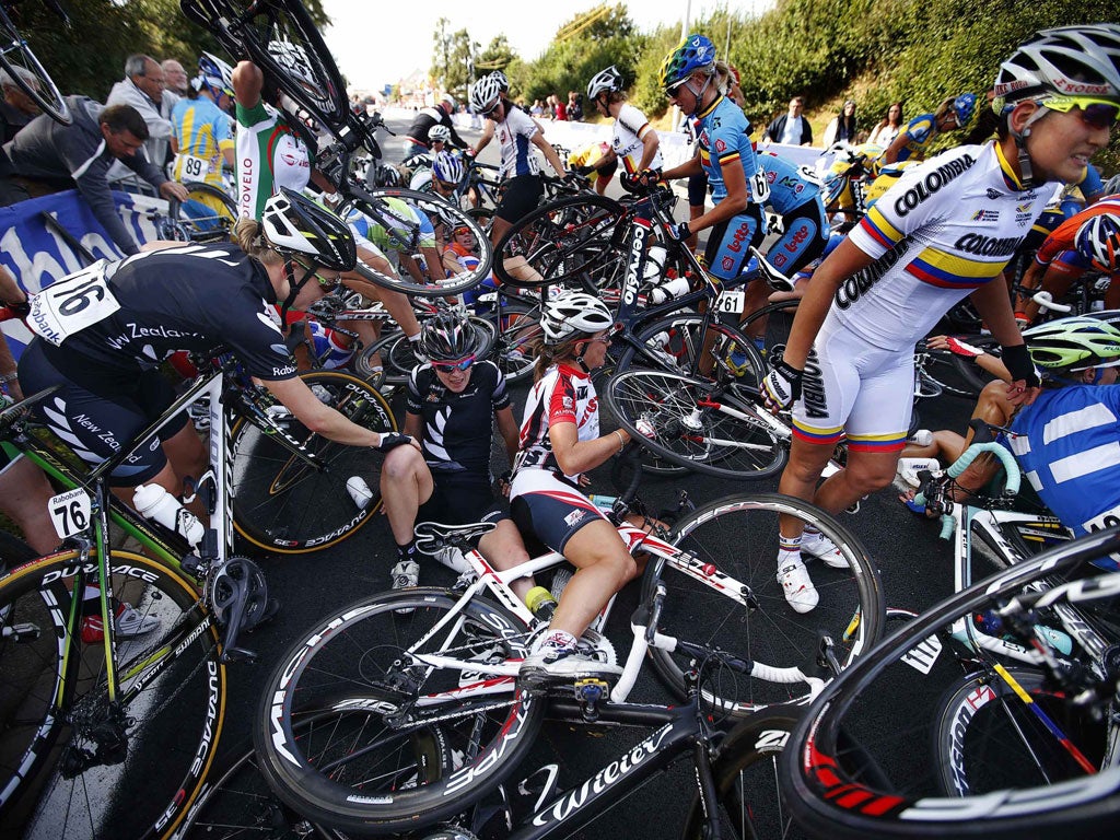 In a spin: Cyclists litter the road after a huge crash in the women's road race. Amazingly, none of the riders was seriously hurt