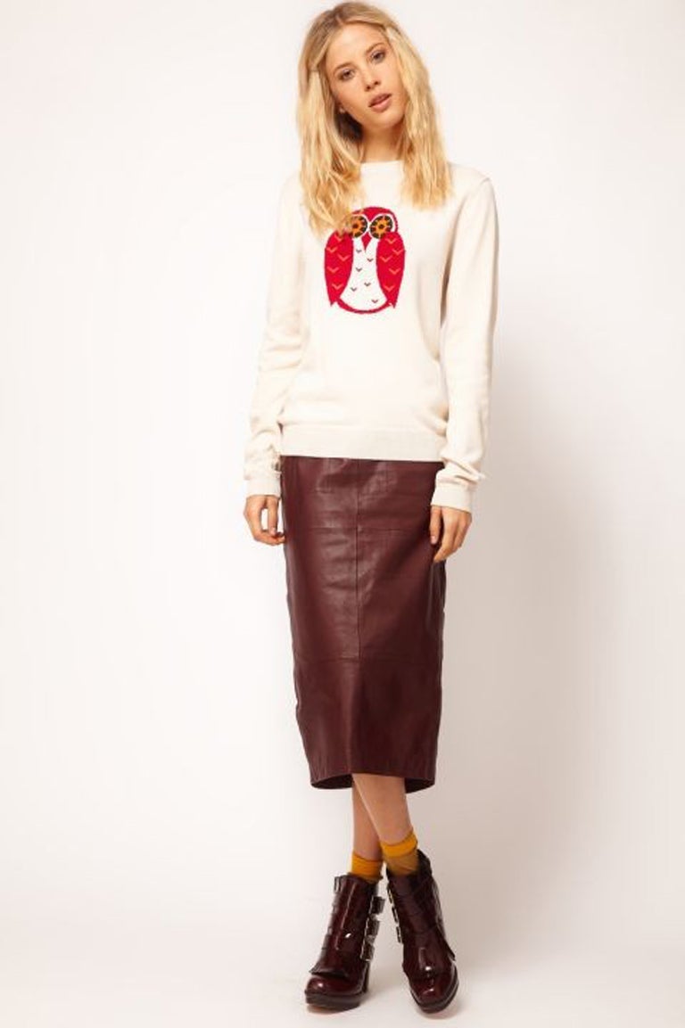 Foxy lady: Owl jumper £30; leather skirt £90, and boots £85, all asos.com