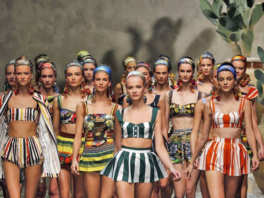Models parade at the end of the Dolce & Gabbana spring/ summer
collection in Milan