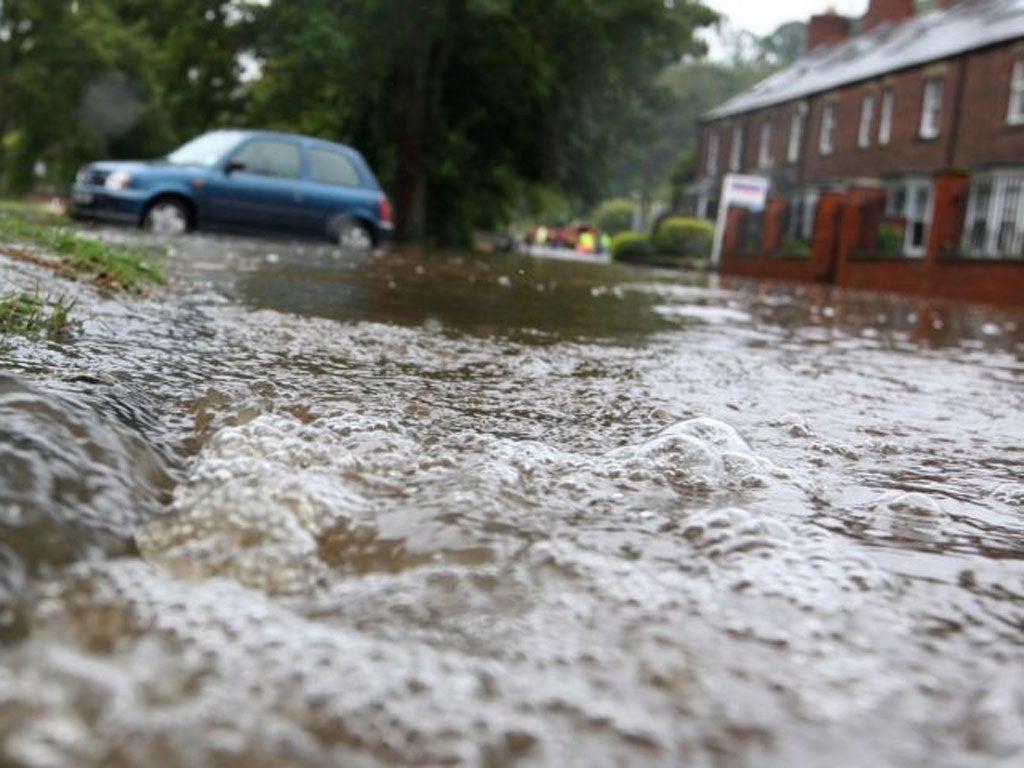 Flashback to 2012: Flood waters pours into a residential street after the River Wansbeck broke its banks in Morpeth