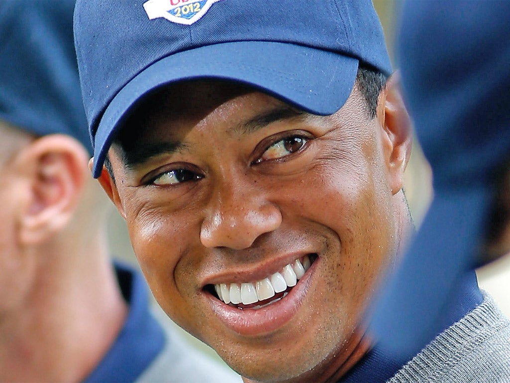 Tiger Woods in high spirits at Medinah yesterday