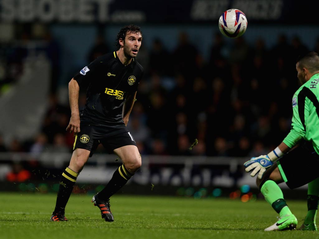 Wigan striker Mauro Boselli scores against West Ham