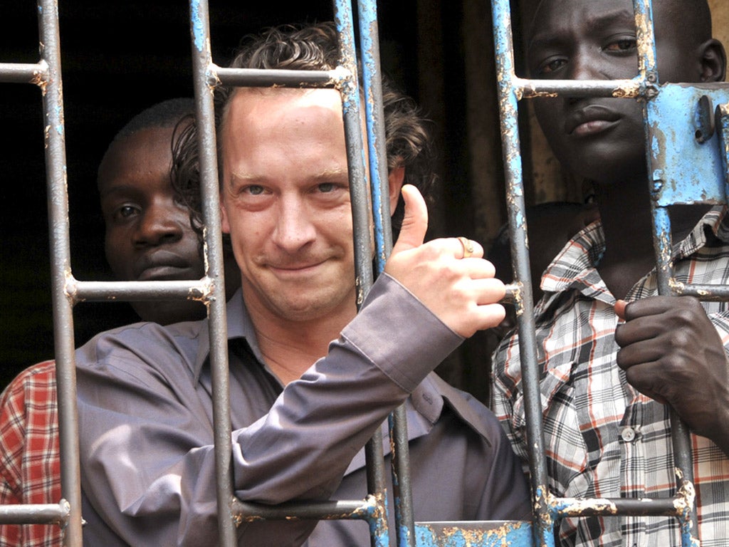 David Cecil in a Kampala court cell after his arrest earlier this month