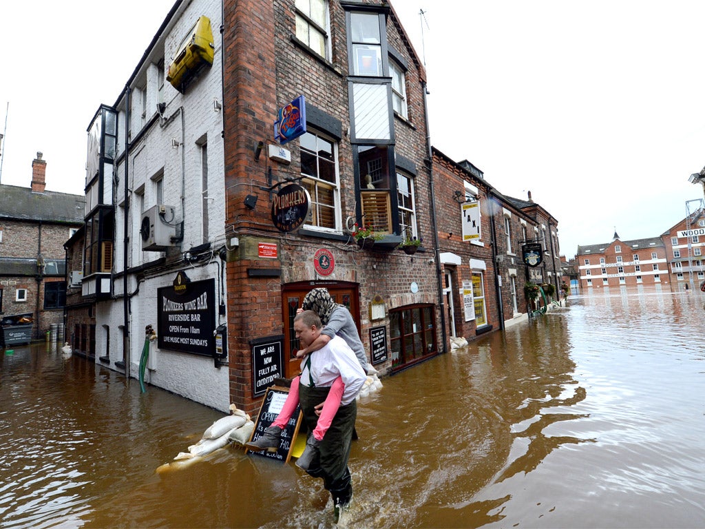 Floodwater sweeps through York city centre after the River Ouse burst its banks