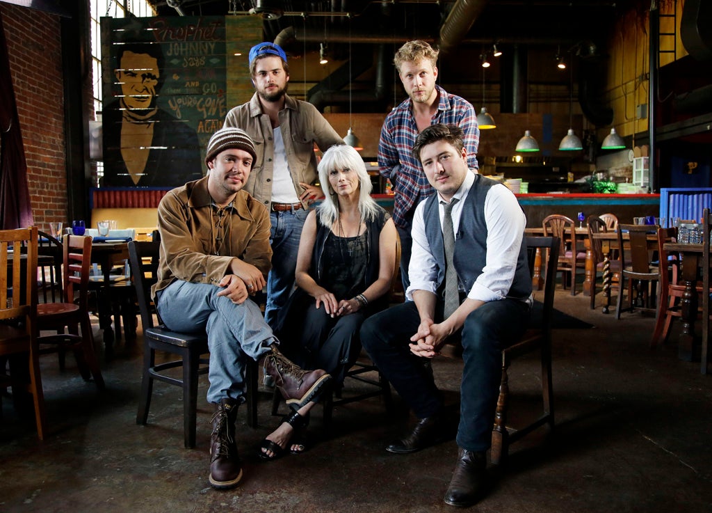 Emmylou Harris (centre) with Mumford & Sons