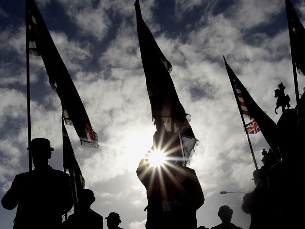 Orange Order members parade through Belfast city centre to mark the 100th anniversary of the Ulster Covenant