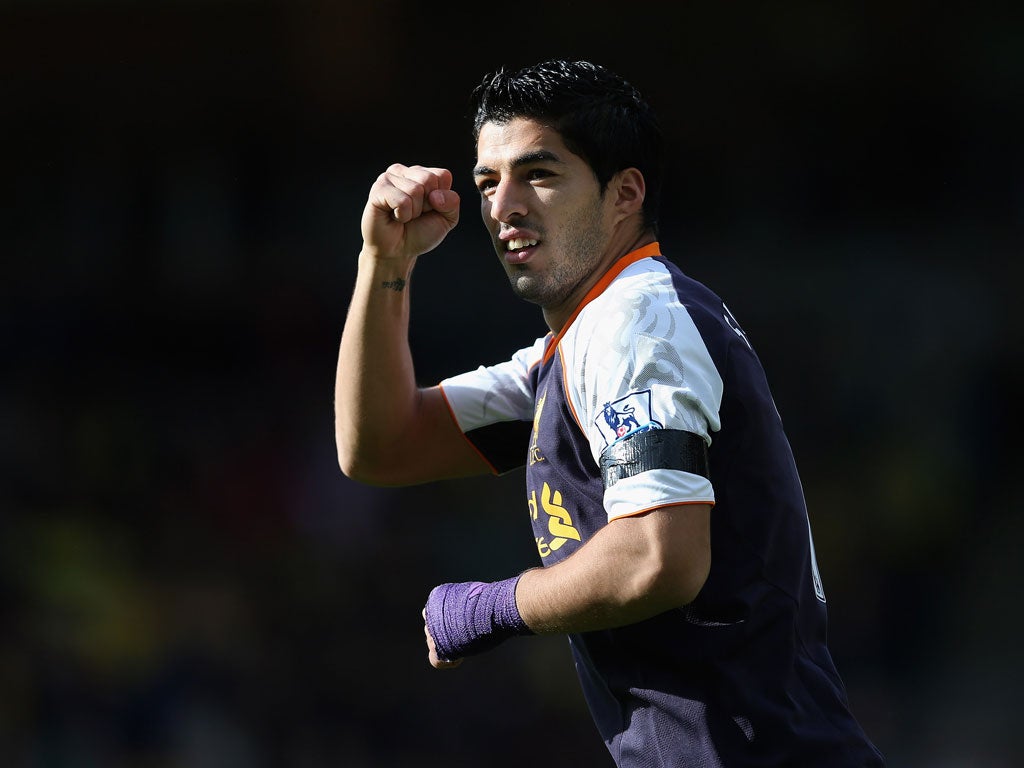 Luis Suarez of Liverpool celebrates scoring their first goal