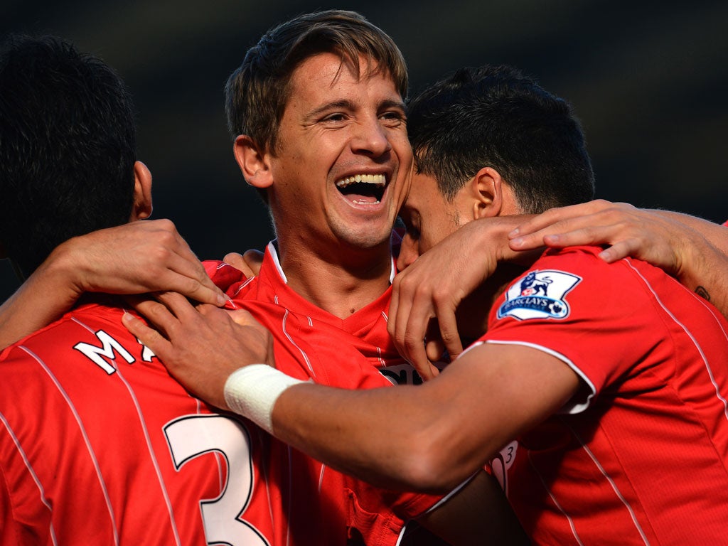 Gaston Ramirez (2nd L) celebrates with team-mates after scoring the opening goal