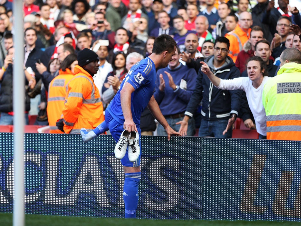 Man of the people John Terry thanks two Chelsea fans for their support by handing them his boots