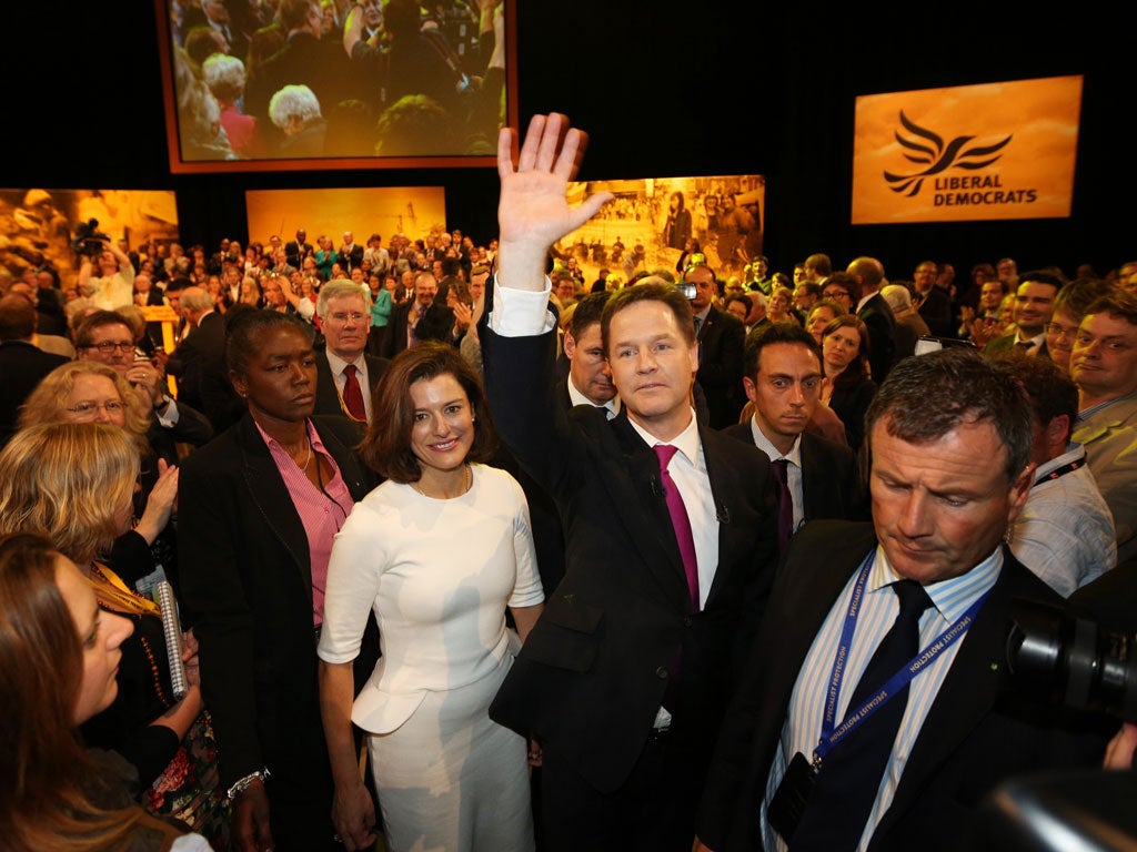 Big hand: Nick Clegg with his wife Miriam Gonzalez Durantez after his conference speech