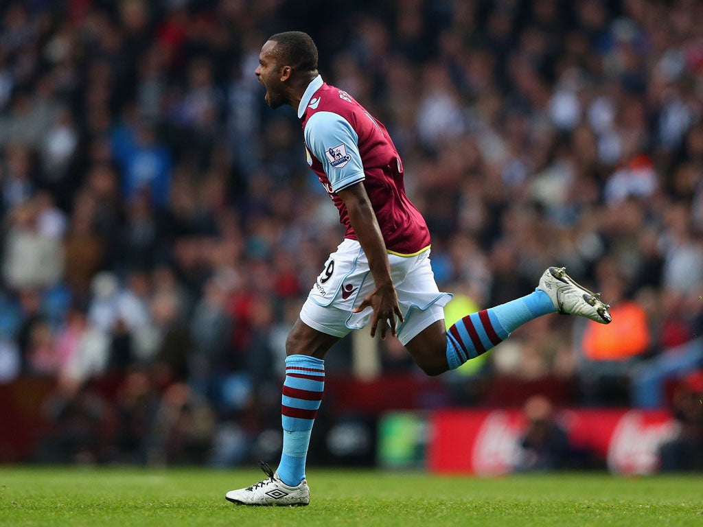 Darren Bent of Aston Villa celebrates after scoring the equalizing goal