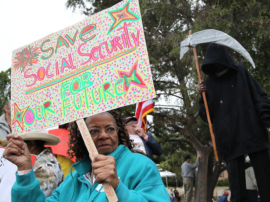 A senior citizen holds a sign during a rally to protect federal health programs at the 8th Annual Healthy Living Festival on July 15, 2011 in Oakland, California.