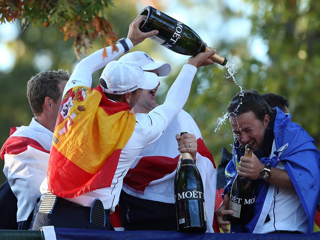 Sergio Garcia, Luke Donald, Nicolas Colsaerts and Graeme McDowell of Europe celebrate after helping their team defeat the United States