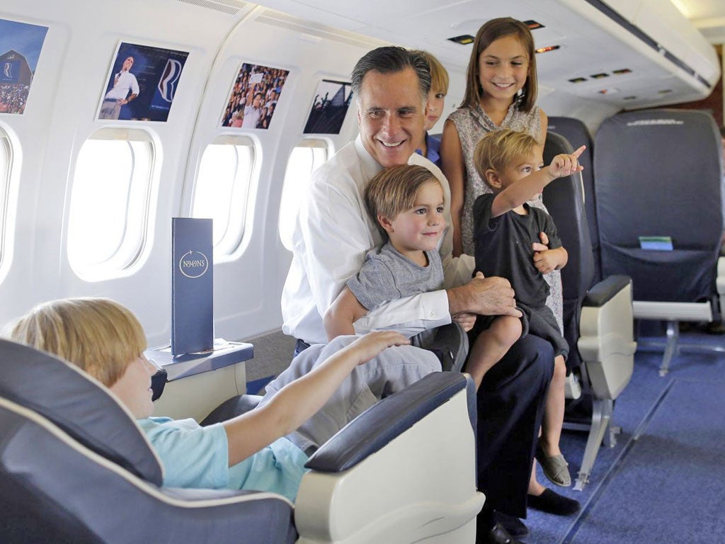 Mitt Romney, the challenger, with his grandchildren