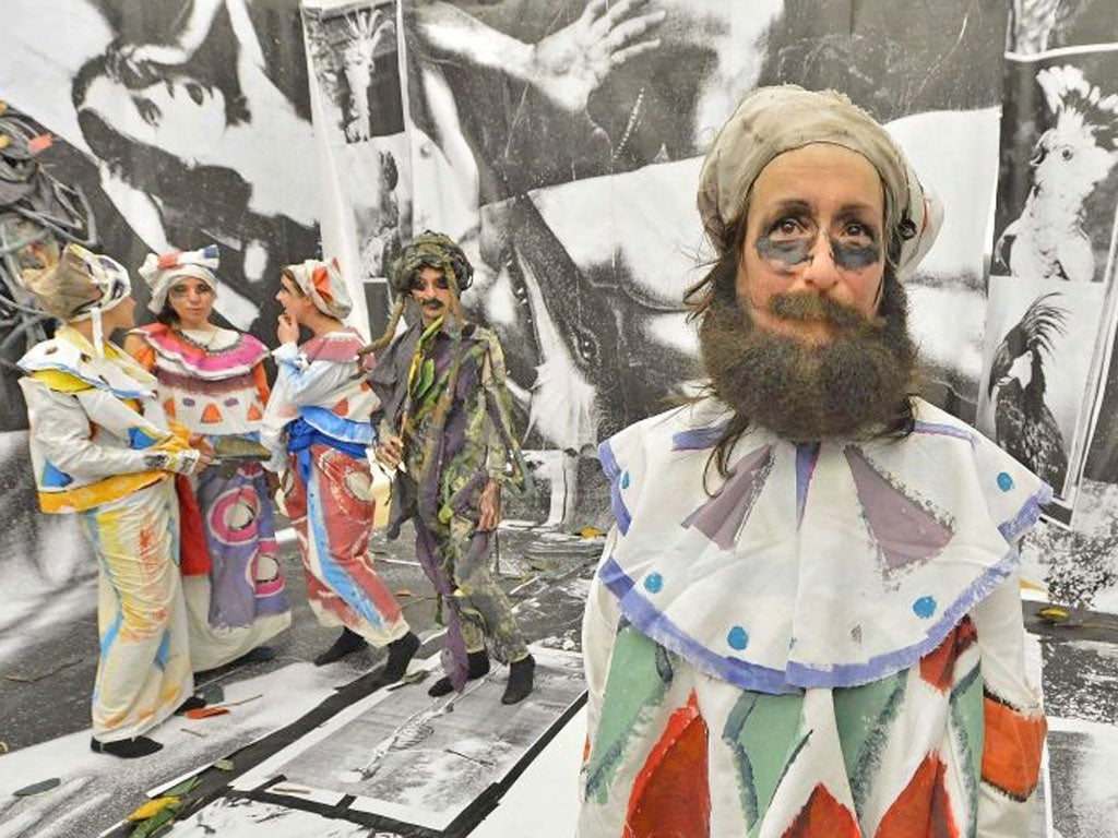 British artist Spartacus Chetwynd (right) with co-performers, as part of 'Odd Man Out 2011', by Chetwynd, at Tate Britain