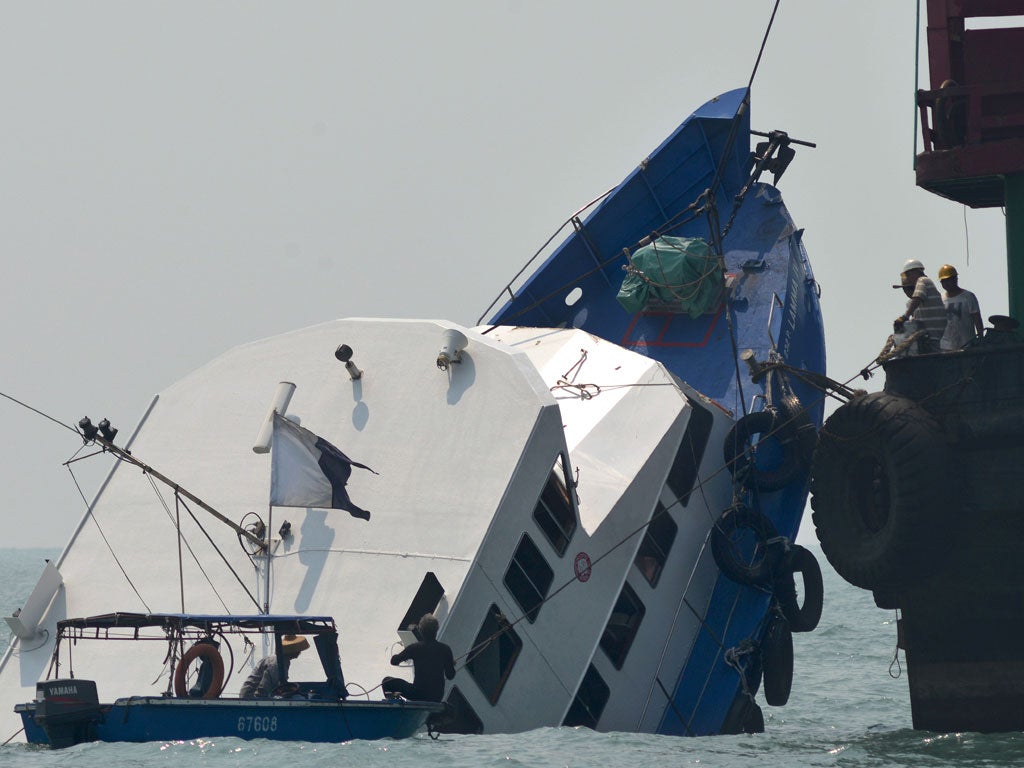 The boat was carrying utility company workers and their families to famed Victoria Harbour to watch a fireworks display in celebration of China's National Day