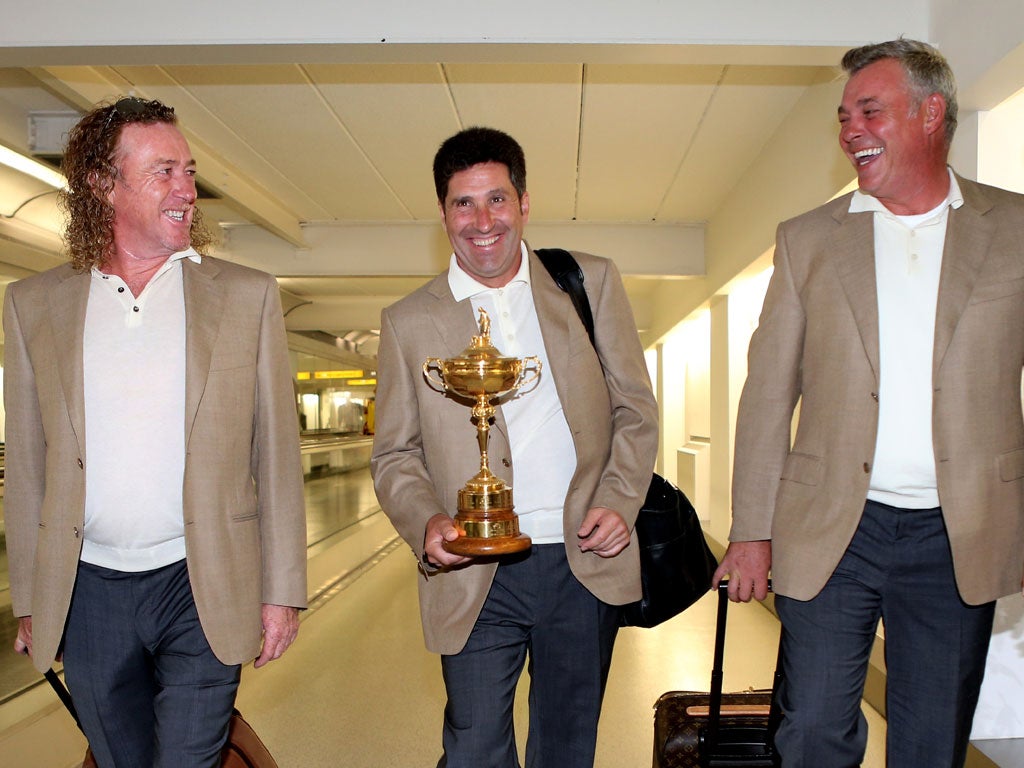 2012 Europe captain Jose Maria Olazabal with the Ryder Cup trophy and his vice-captains Miguel Angel Jimenez (L) and Darren Clarke