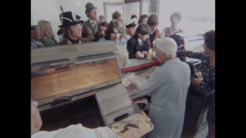 A still taken from long-forgotten footage of The Beatles visiting a chip shop in Somerset as they filmed their surreal road movie Magical Mystery Tour