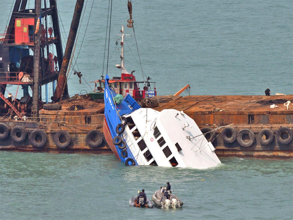 The Lamma IV is held in place by a salvage operation