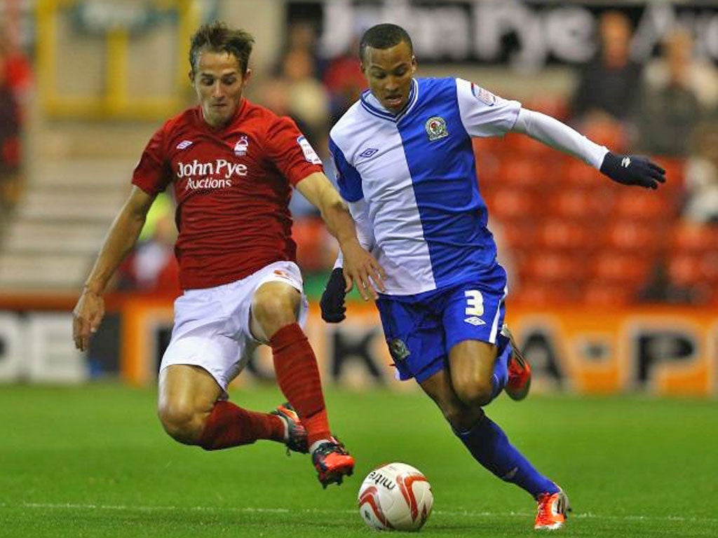 Chris Cohen of Forest battles with Blackburn’s Martin Olsson