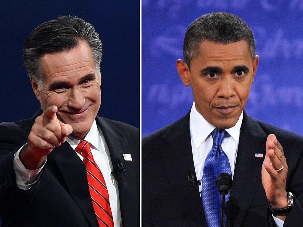 Mitt Romney and Barack Obama at the conclusion of the debate in Denver, Colorado