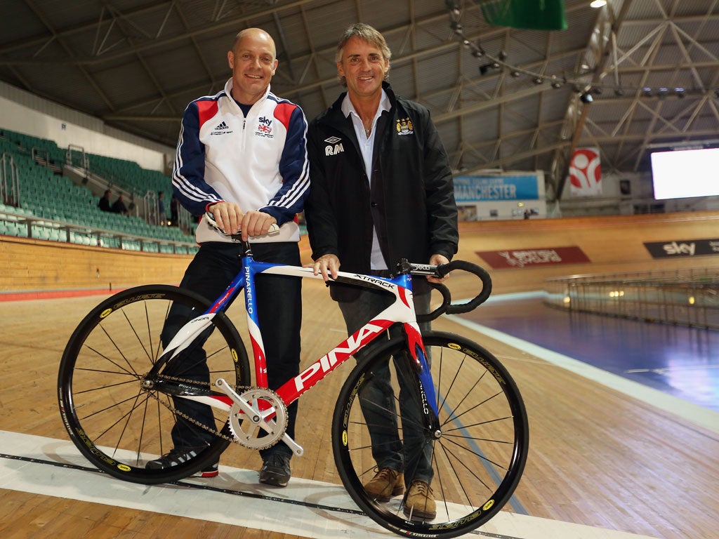 Roberto Mancini joins Dave Brailsford at Manchester Velodrome