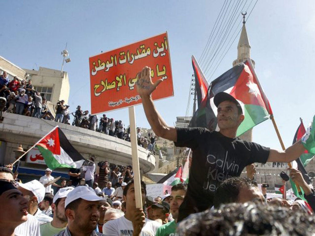 Demonstrators take to the streets of Amman yesterday