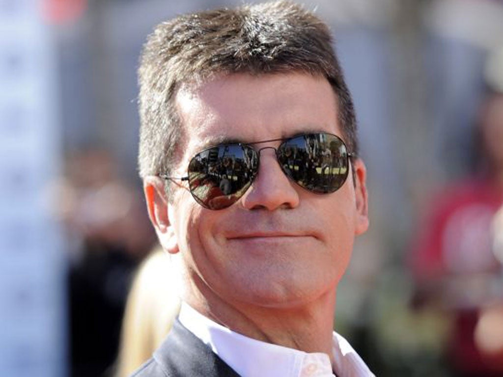 Simon Fuller is plotting to outmanoeuvre his great rival, Simon Cowell (pictured)