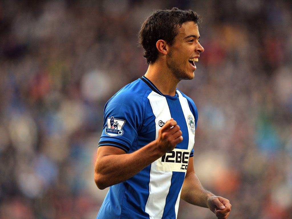 Wigan 2-2 Everton Wigan Athletic's Argentinian striker Franco Di Santo celebrates scoring their second goal