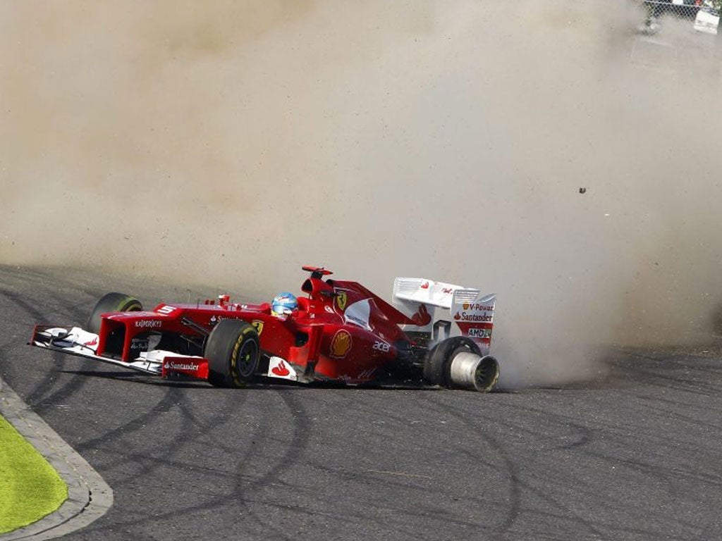 Fernando Alonso spins off on the first corner of the Japanese Grand Prix