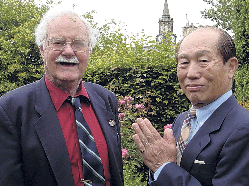 Truth and reconciliation: Lomax meets Osamu Komai, the son of his wartime interrogator, in 2007