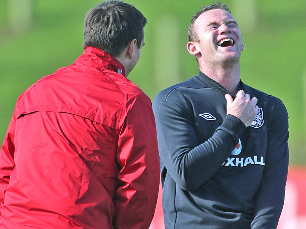 Wayne Rooney sees the funny side to some serious training yesterday