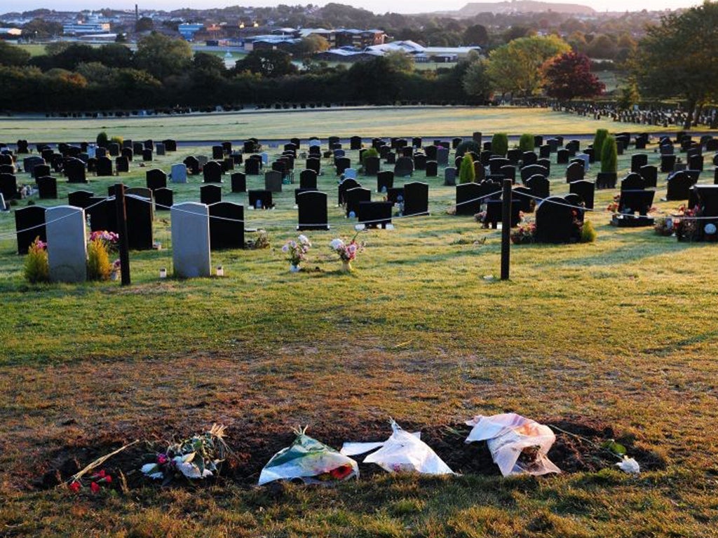 Flowers lay in place of Sir Jimmy Savile's gravestone at Woodlands Cemetery in Scarborough this morning