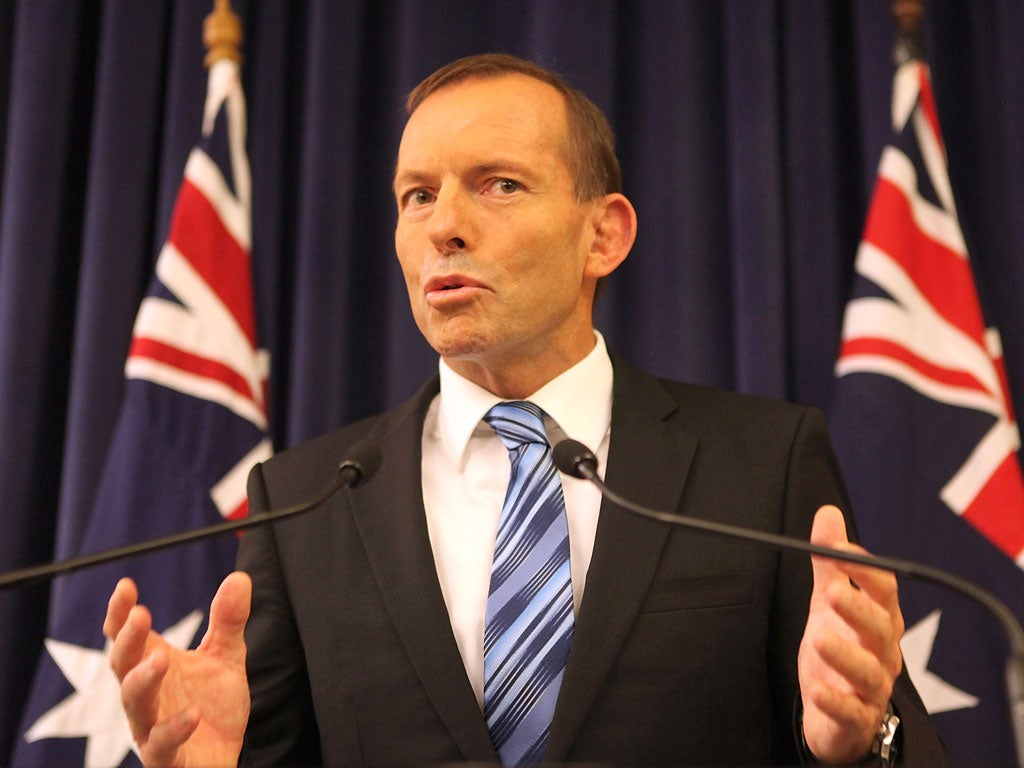 Australian PM Tony Abbott vows to 'shirtfront' Vladimir Putin over the downing of MH17