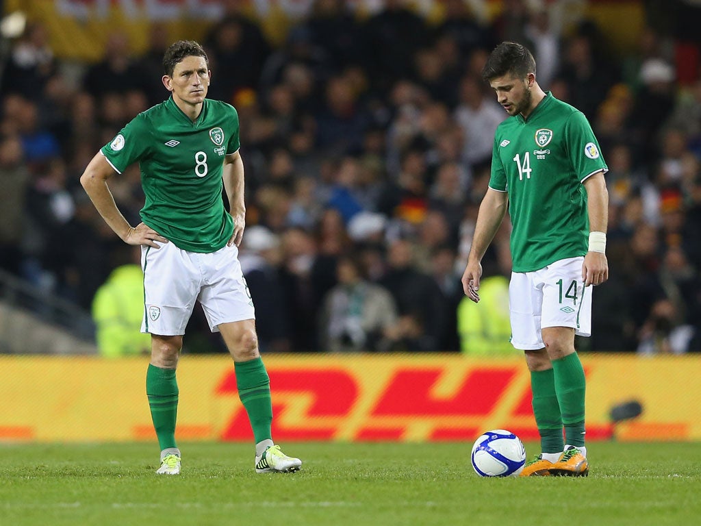 Keith Andrews and Shane Long of the Republic of Ireland look disheartened after Germany's sixth goal goes in