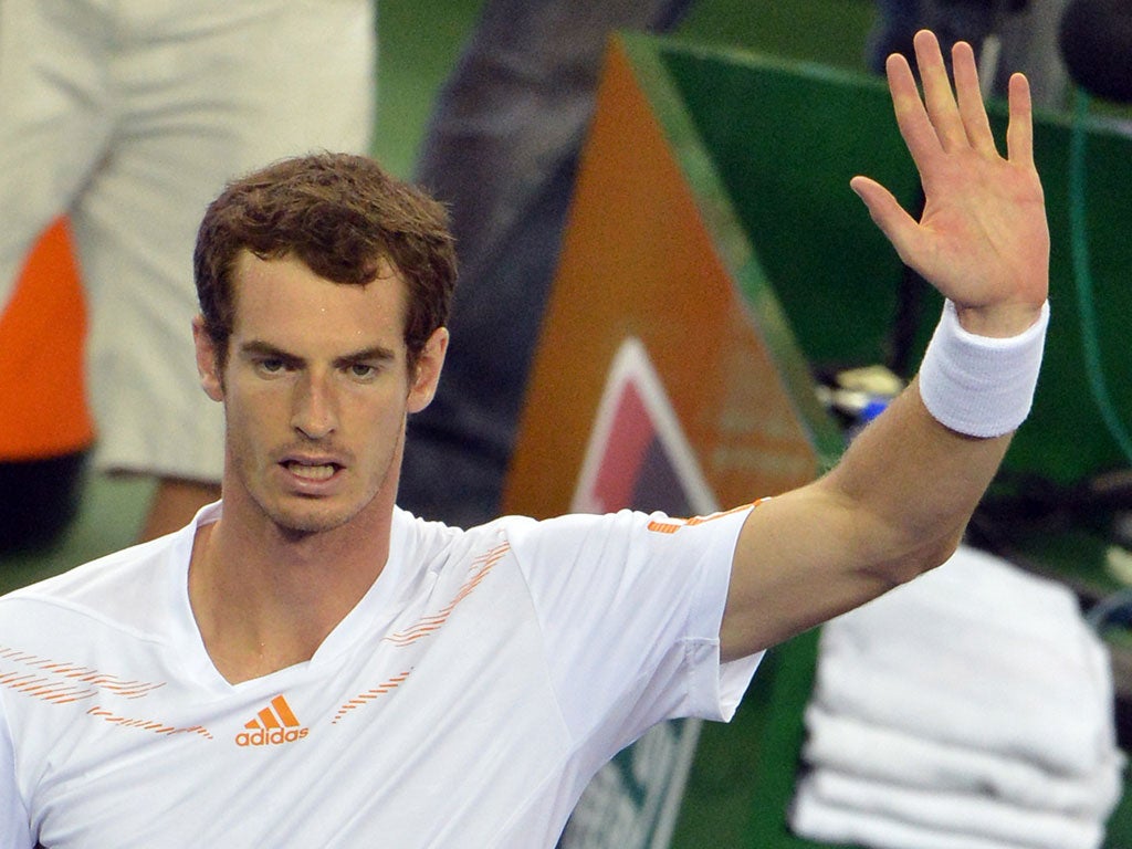 Andy Murray of Britain celebrates after defeating Roger Federer of Switzerland during their semi-finals match at the Shanghai Masters tennis tournament