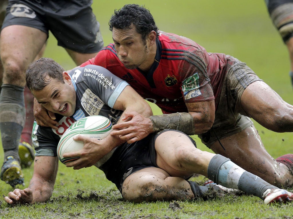 Grounded: Racing's Olly Barkley is tackled by Doug Howlett of Munster