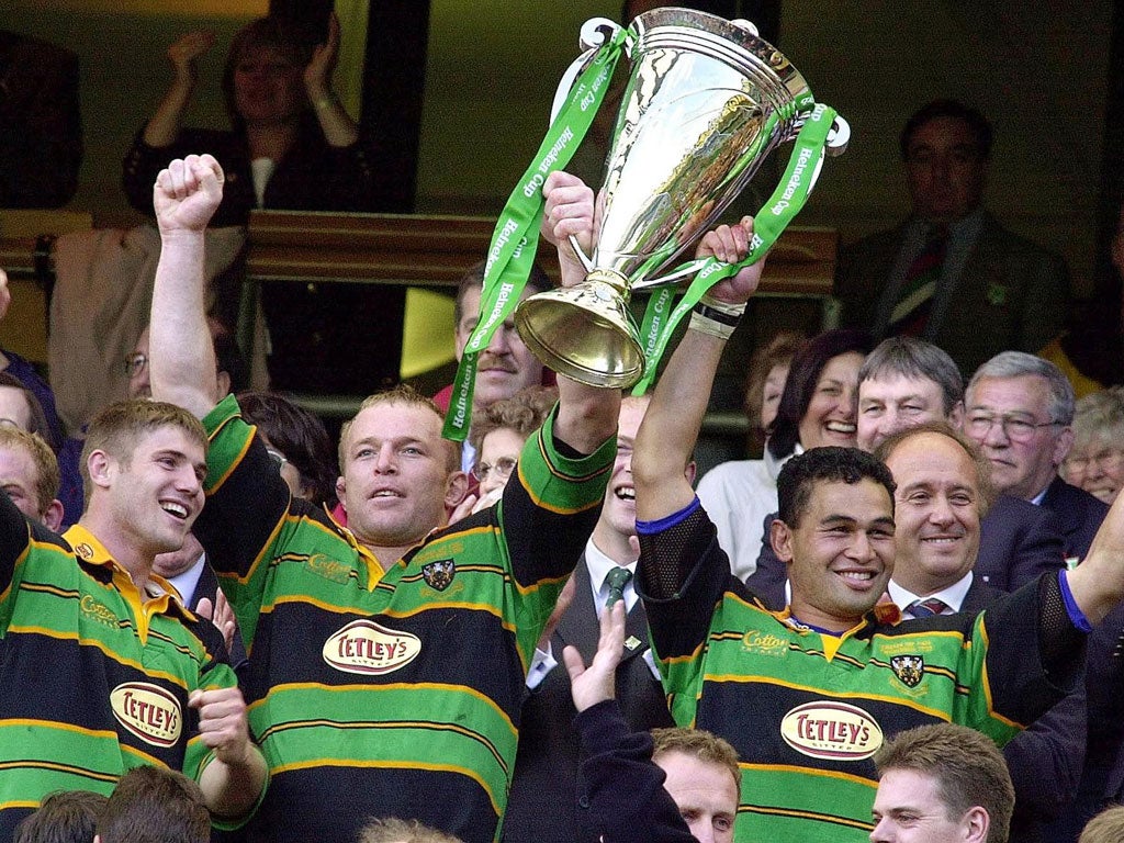Saints and sinners: Northampton's Tim Rodber (left) and Pat Lam raise the Heineken Cup in 2000 after beating Munster