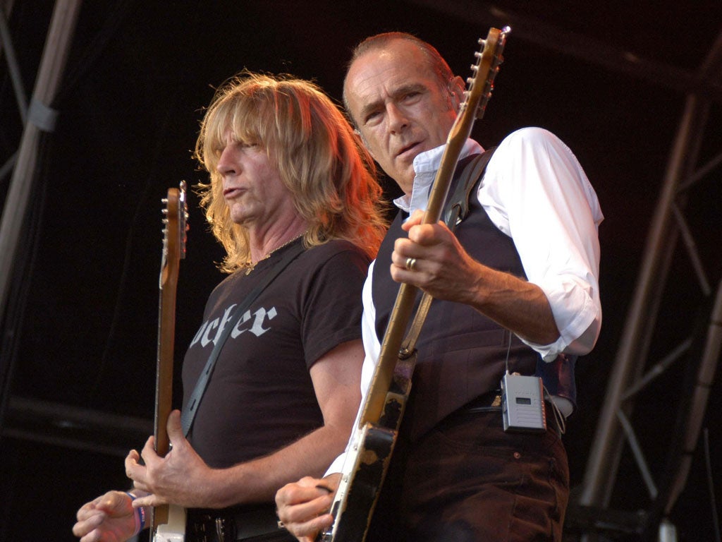 Still rockin': Rick Parfitt, left, and Francis Rossi on stage