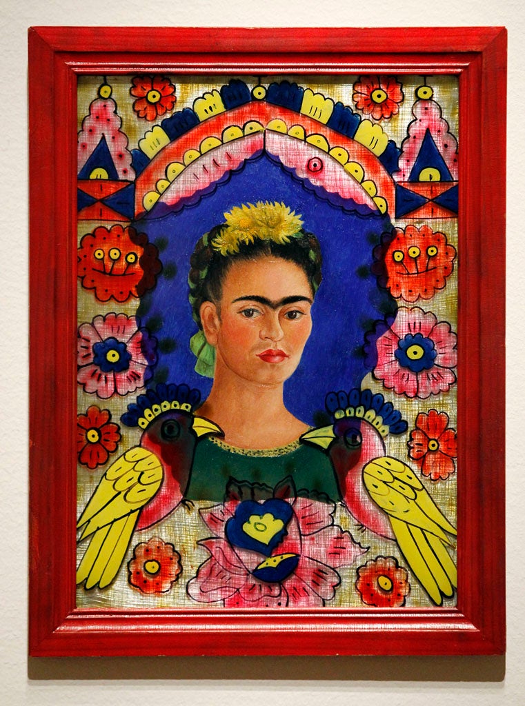 A painting by Frida Kahlo (The Frame, 1938) is seen as part of one of two new exhibits featuring art exclusively by women at the Seattle Art Museum.
