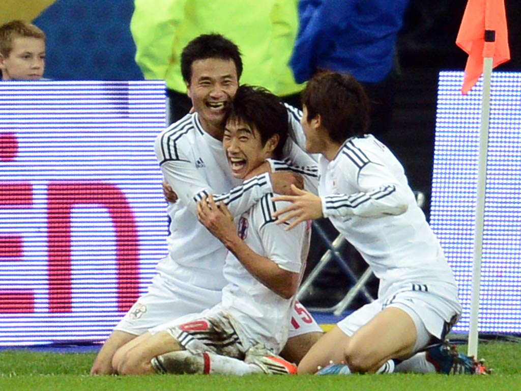 Shinji Kagawa celebrates his goal for Japan against France