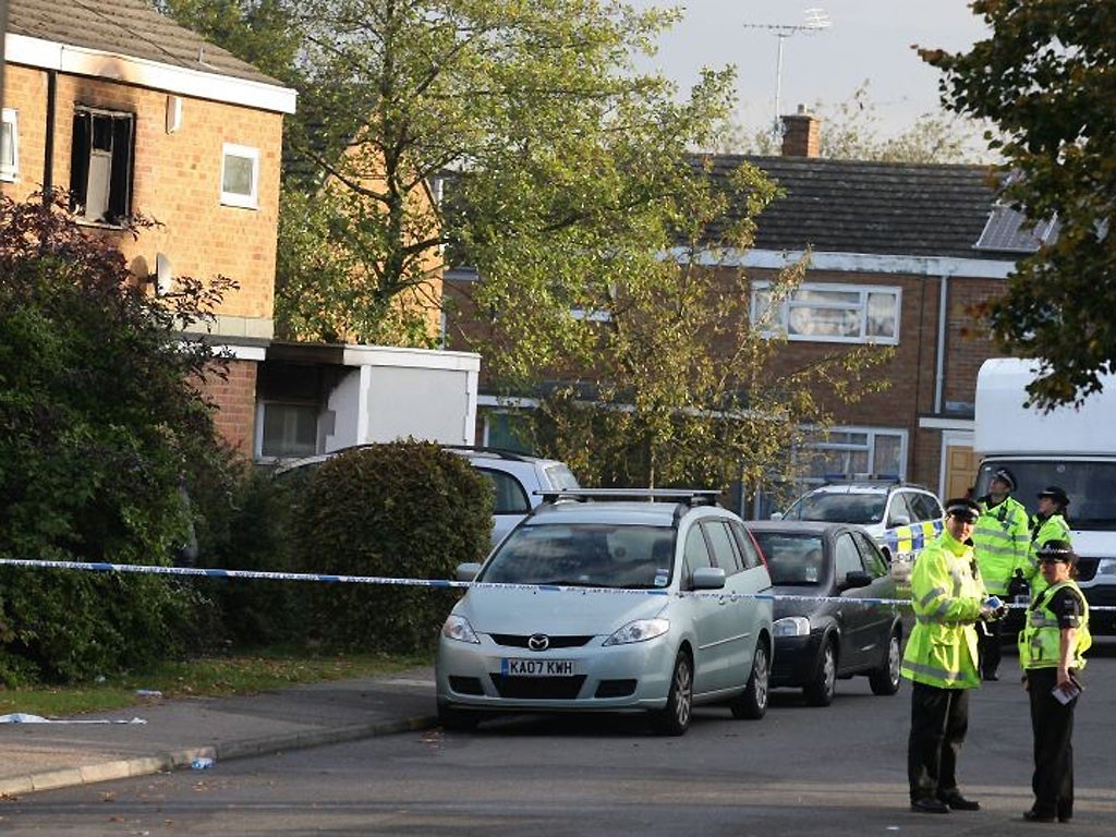 Police at the front of the house in Harlow