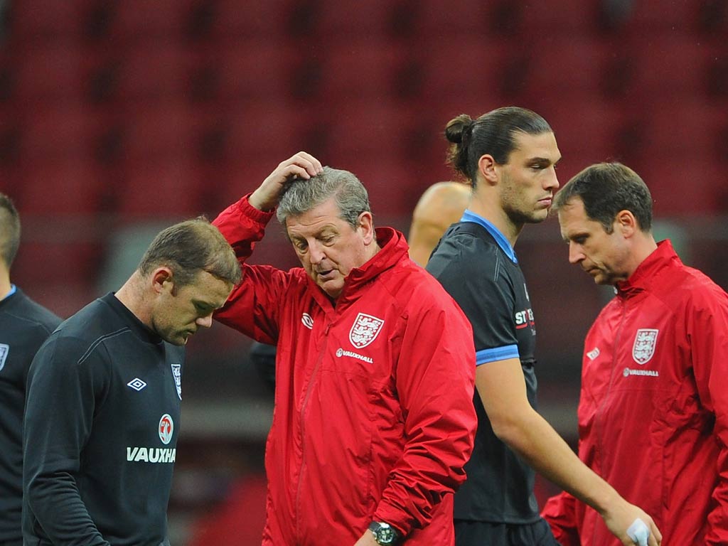 Andy Carroll with Wayne Rooney and Roy Hodgson