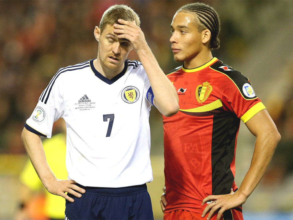 Darren Fletcher looks dejected as Scotland's qualification hopes took another blow