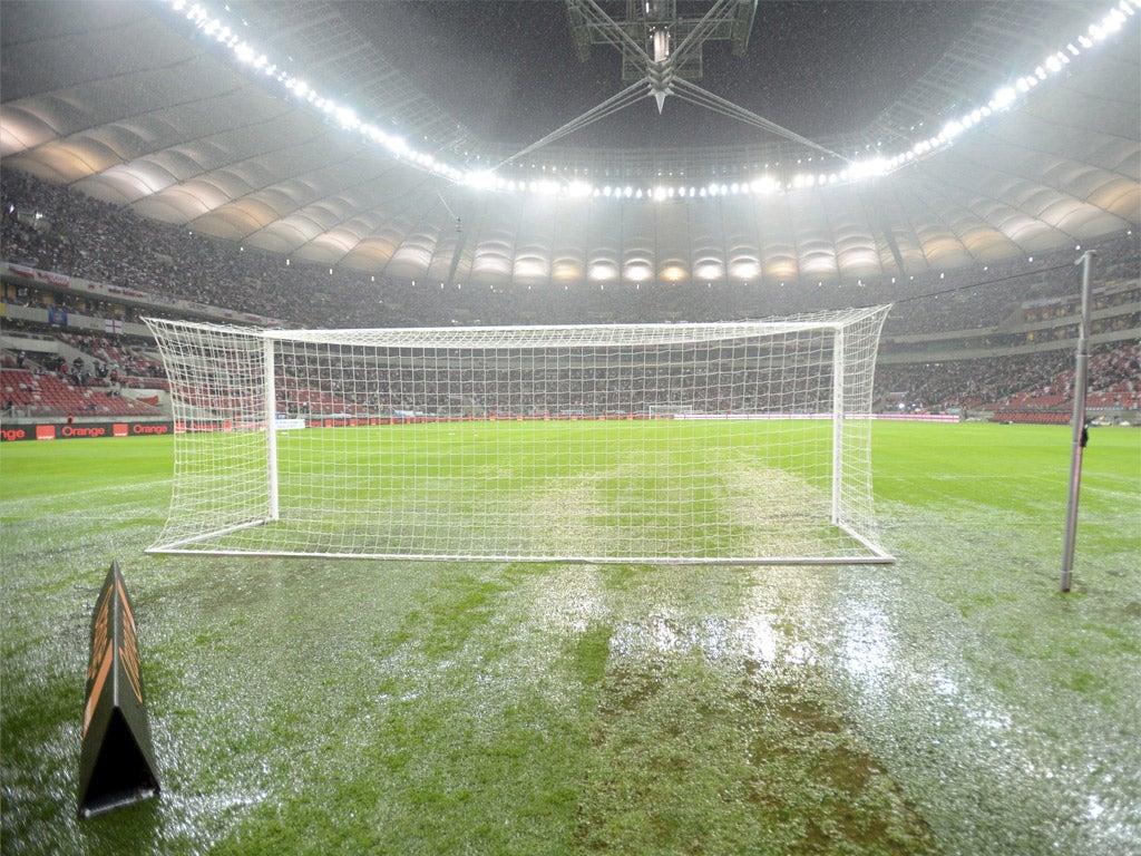 The puddle-ridden pitch at the National Stadium in Warsaw last night