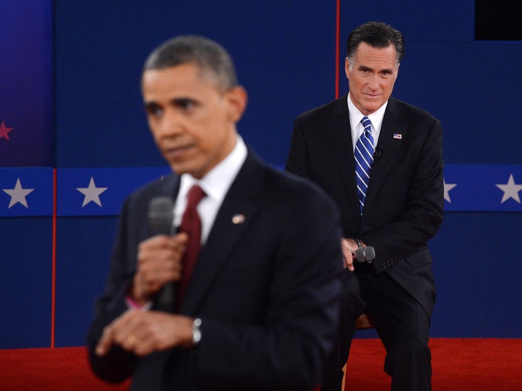 Barack Obama and Mitt Romney during the second presidential debate in 2012 (Getty)