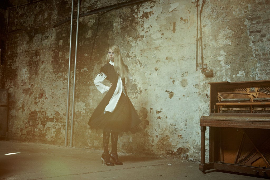 Embroidered wool coat, £,3250, and tulle skirt, £2,480, both by Nina Ricci, from Harrods, 87-135 Brompton Road, London SW1, 020-7730 1234; Shirt dress, £405, by Richard Nicoll, richardnicoll.com; tights, £12, by house of holland for pretty polly, prettypolly.co.uk; Crystal heel boots, £1,000, by Chanel, 26 Old Bond Street, London SW1, 020-7493 5040