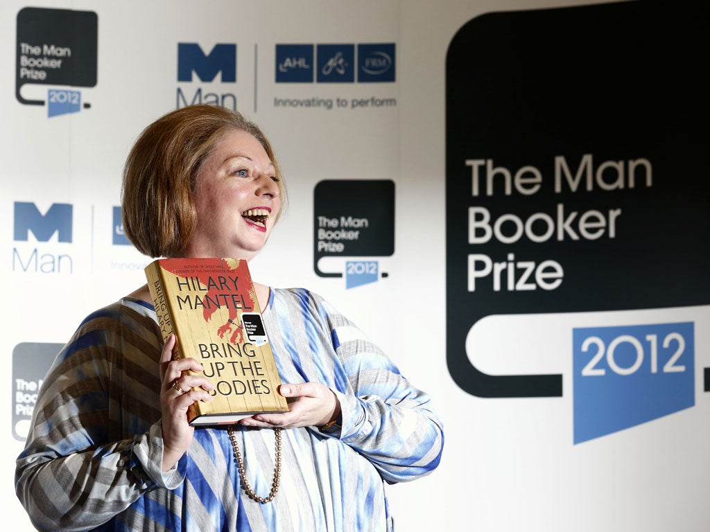 British author Hilary Mantel poses for pictures after winning the 2012 Man Booker literary prize for her novel 'Bring Up The Bodies' in London on October 16, 2012.