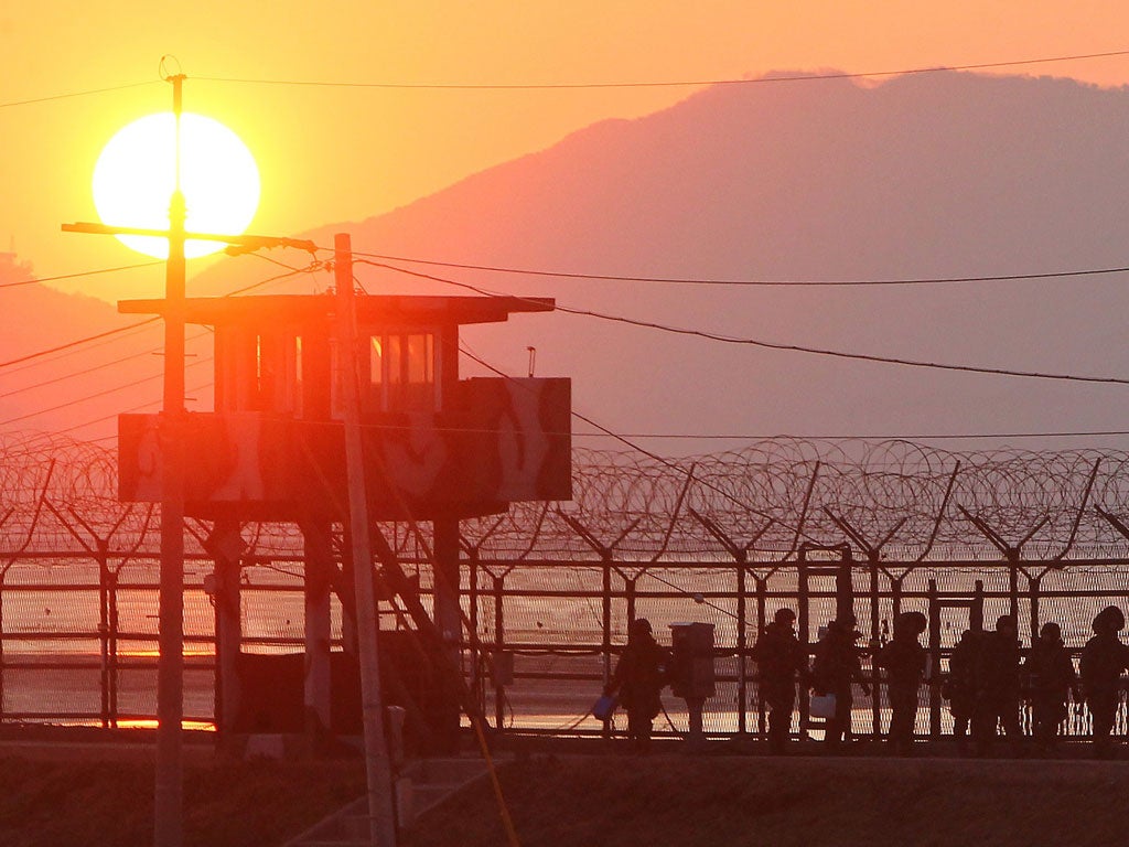 On the lookout: Dividing the two Koreas is an 18km partition, the world's most fortified border