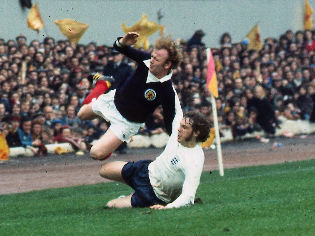 Flying Scotsman: Mike Pejic tackles Billy Bremner at Hampden in 1974